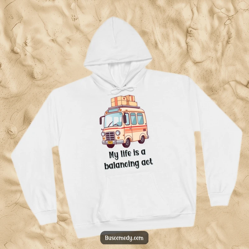 Funny hoodie featuring a small bus carefully balancing a stack of packages on its roof, symbolizing delivery duty.