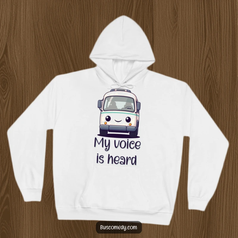 Funny hoodie featuring a small, round, friendly bus character honking its horn, perfect for cozy commutes and cheerful days.